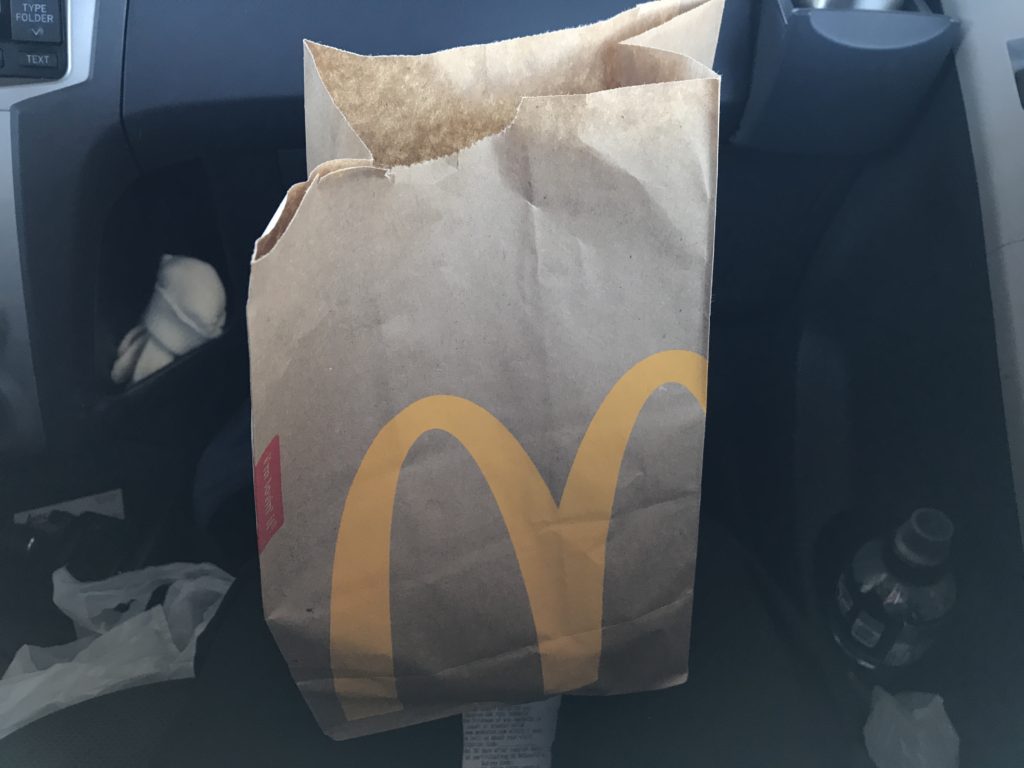 McDonalds takeout in car - Tips for vegan road tripping
