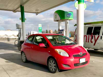 bp-red car at gas-station - Tips for vegan road tripping