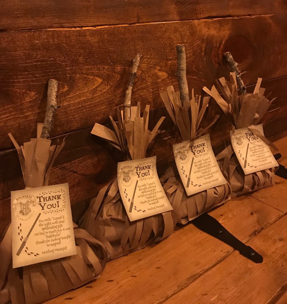 Vegan Harry Potter Party Broomstick Goody Bags filled with Honeydukes candy and Dementors Relief chocolate bars and party favors.
